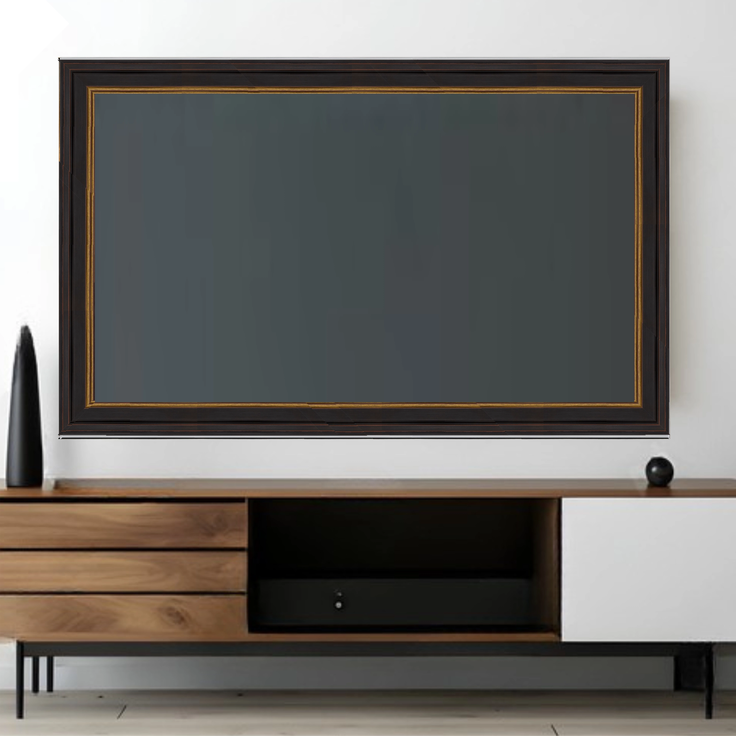 black-framed-television-gold-trim-tv-frame-living-room Wall mounted television with a black decorative TV frame and gold inner trim above a modern media console