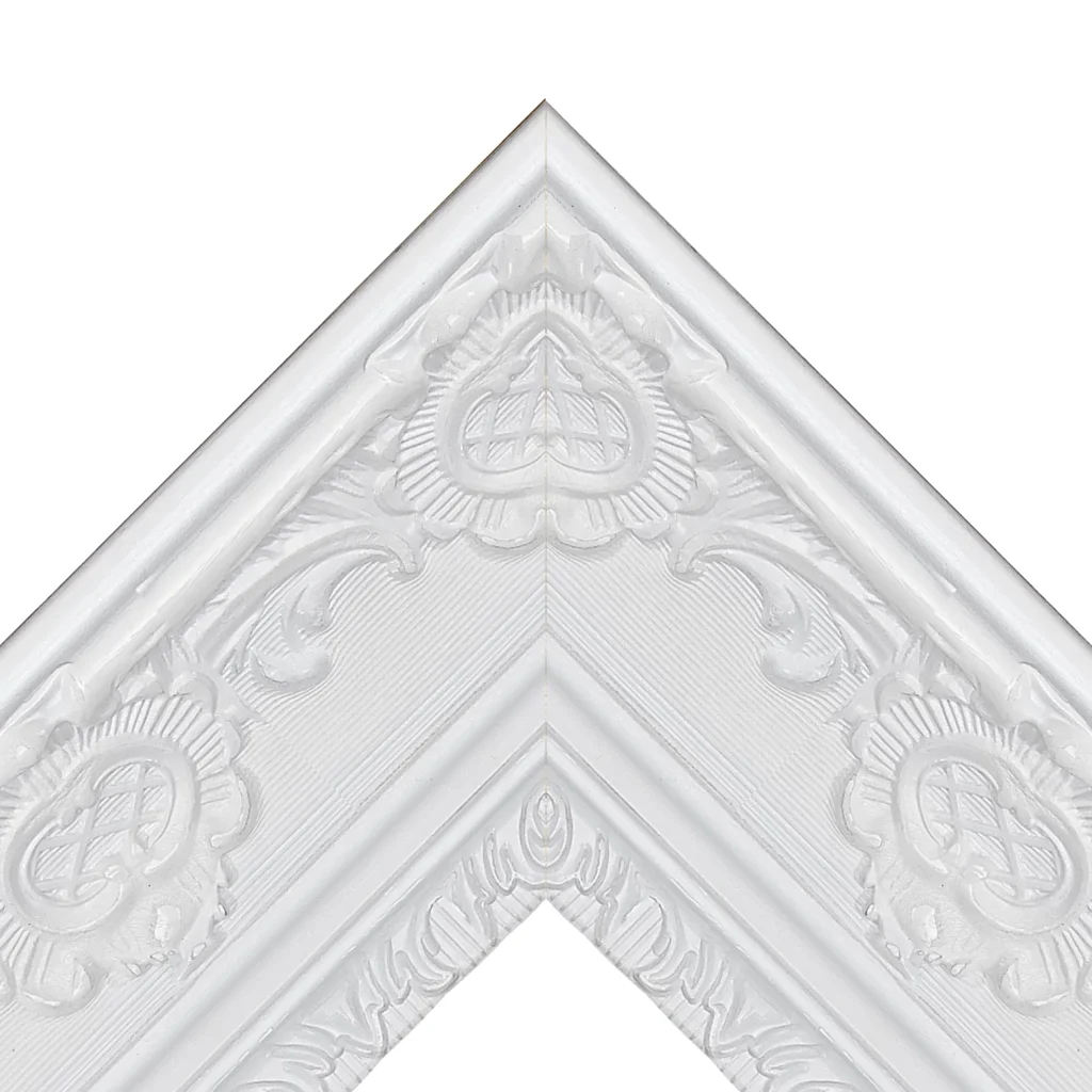 White baroque ornate TV frame corner with intricate decorative molding and carved detail